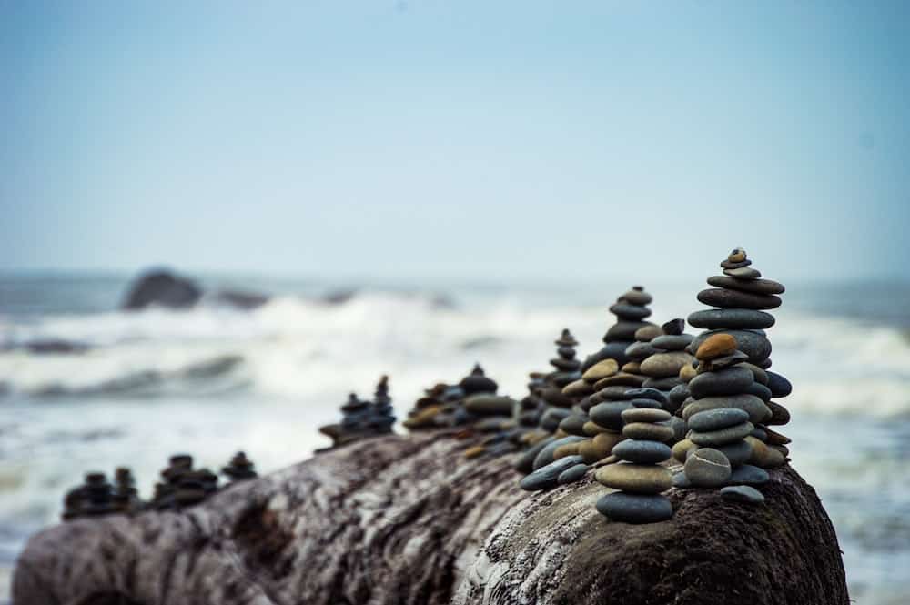 A stack of many river rocks, with some more likely to fall than others.
