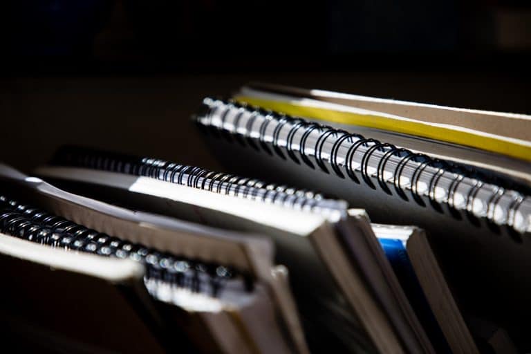 spiral bound notebooks stacked together