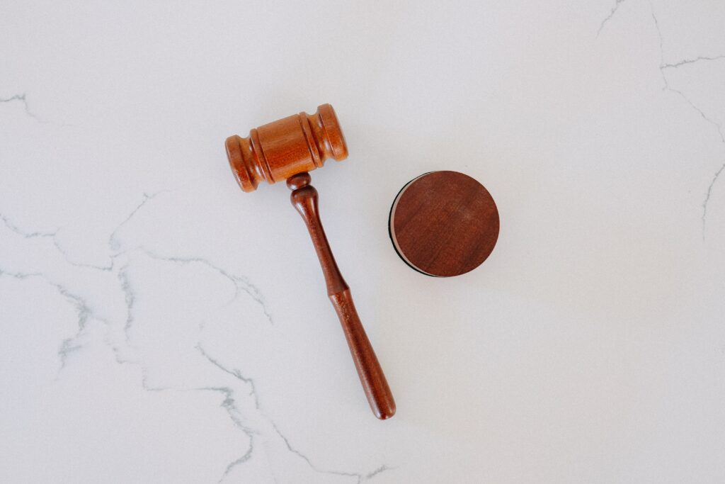 An image of a judge's gavel against a white background. 