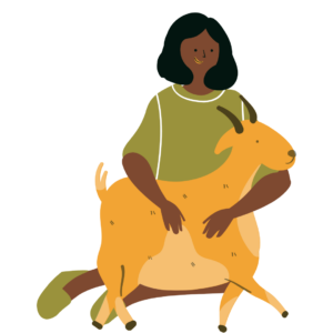A person with black hair, brown skin and a green shirt sits on the ground with a yellow goat in their lap.