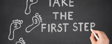 A chalk board reads "Take The First Step" and has four footprints to the left labeld, 1, 2,3, and 4.