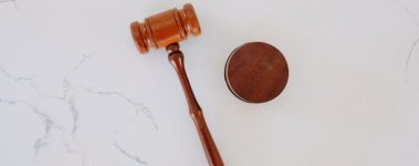 An image of a judge's gavel against a white background.